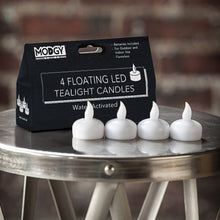 Load image into Gallery viewer, White Lumizu Lights Four pack of LED water activated candles..
